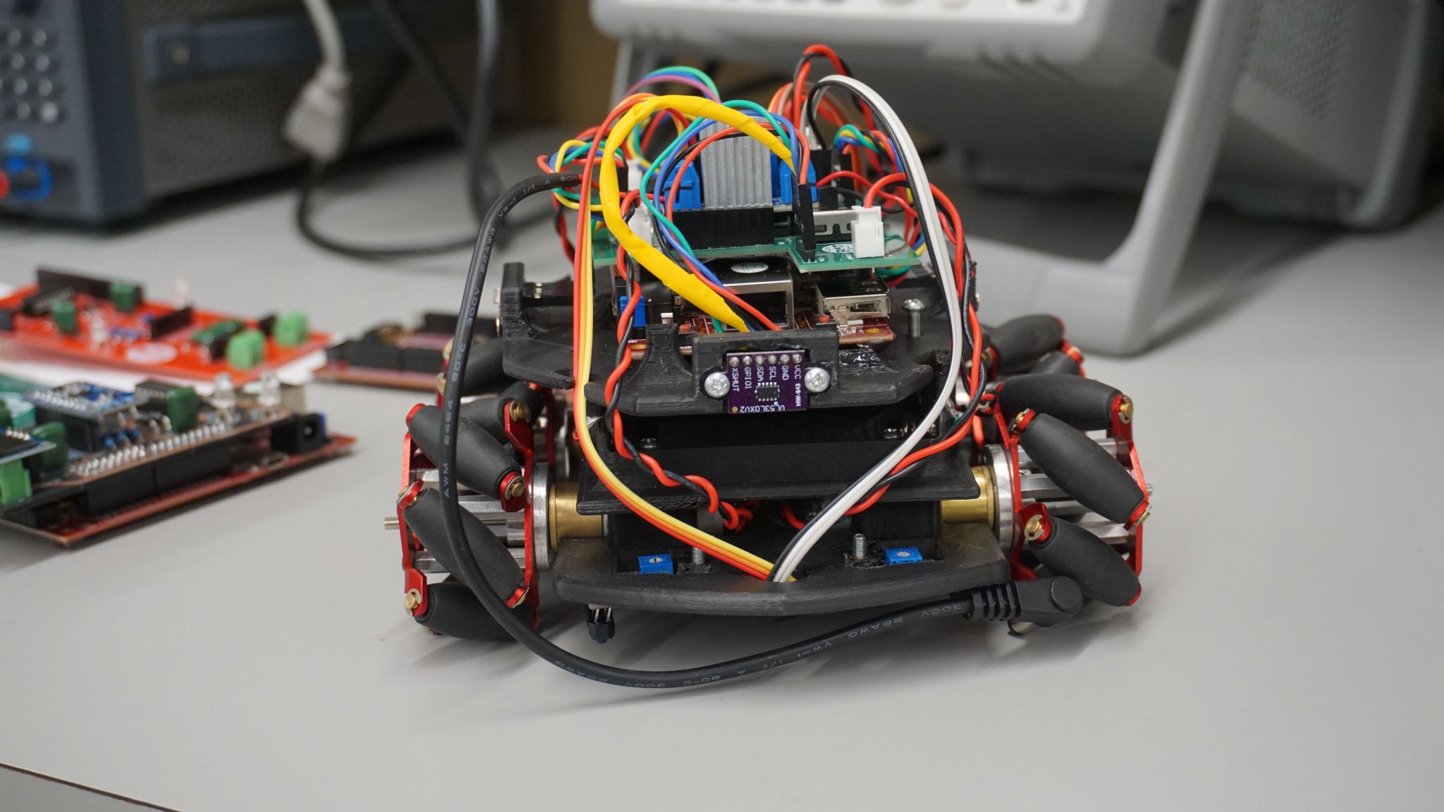 Completed autonomous FPGA robot with its sensors, electronics, and mecanum wheels